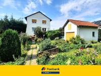Wohnimmobilie Kauf Einfamilienhaus Charmantes Haus auf Erbpachtgrundstück mit zwei separaten Wohnungen und großem Garten