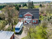 Wohnimmobilie Kauf Einfamilienhaus Traumhaftes Schwedenhaus auf großem Grundstück mit Doppelcarport und Sauna