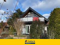 Wohnimmobilie Kauf Einfamilienhaus Grünes idyllisches Grundstück mit außergewöhnlichem Haus