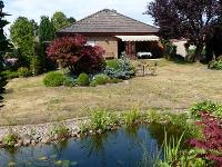Wohnimmobilie Kauf Einfamilienhaus Bungalow mit Garage und Vollkeller traumhaftes Südgrundstück - Nienburg / Langendamm