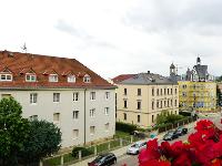 Wohnimmobilie Kauf Etagenwohnung gemütliche Dachgeschosswohnung mit Balkon und Ausblick